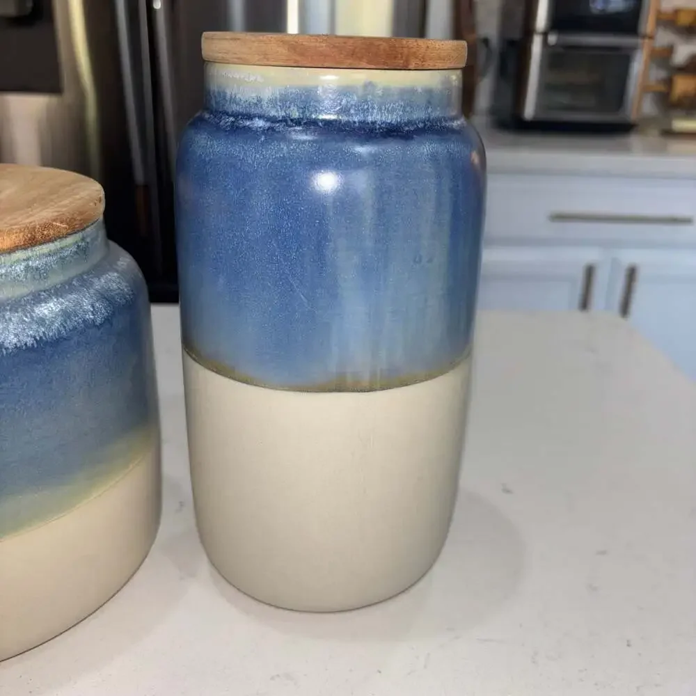 Set of 2 World Market Blue and Cream Ceramic Canisters Wooden Lids